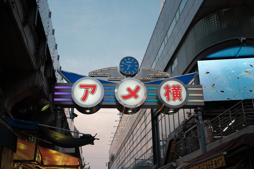 Clock tower in Japanese city representing time-sensitive nature of NFT gaming Ponzi schemes