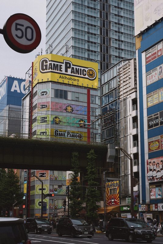 Akihabara Tokyo district buildings and neon signs, Japan's gaming and tech hub amid NFT gaming concerns