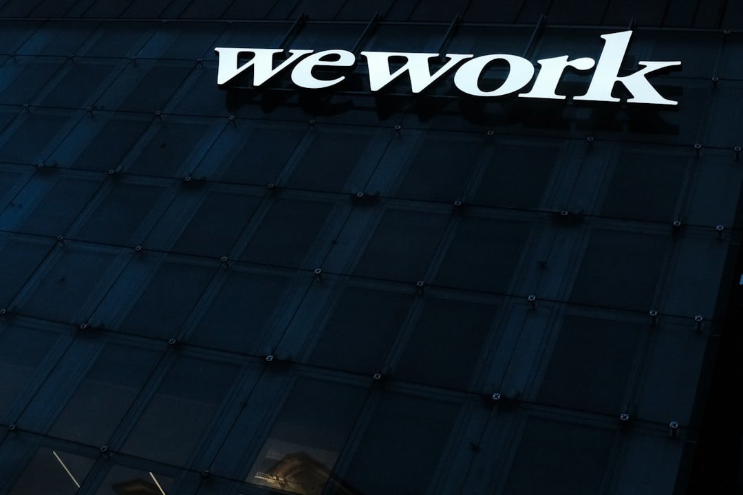 WeWork office building signage representing corporate tech adoption and blockchain identity verification infrastructure
